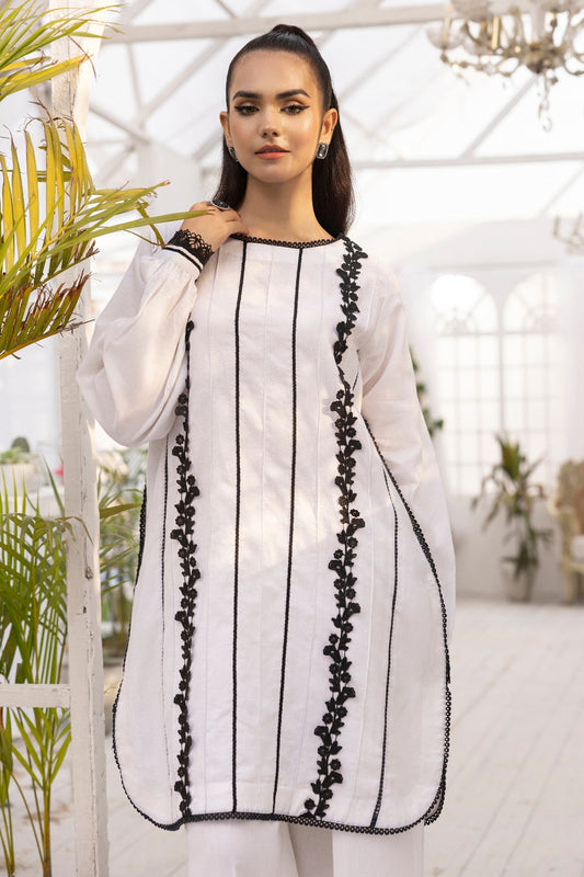 a girl is wearing 2 PC unstitched dobby shirt set with in white color with black design on it