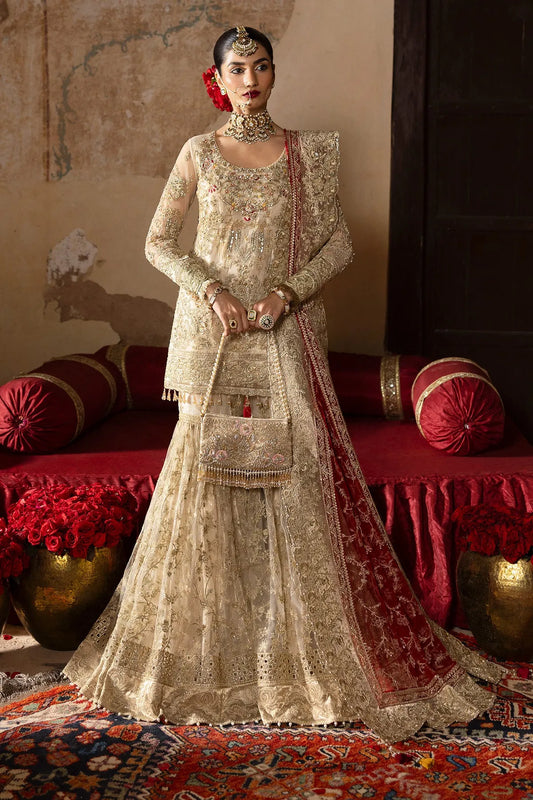 A traditional bridal outfit featuring a net dupatta, gharara, and embroidered net front and back with shimmer chiffon lining.