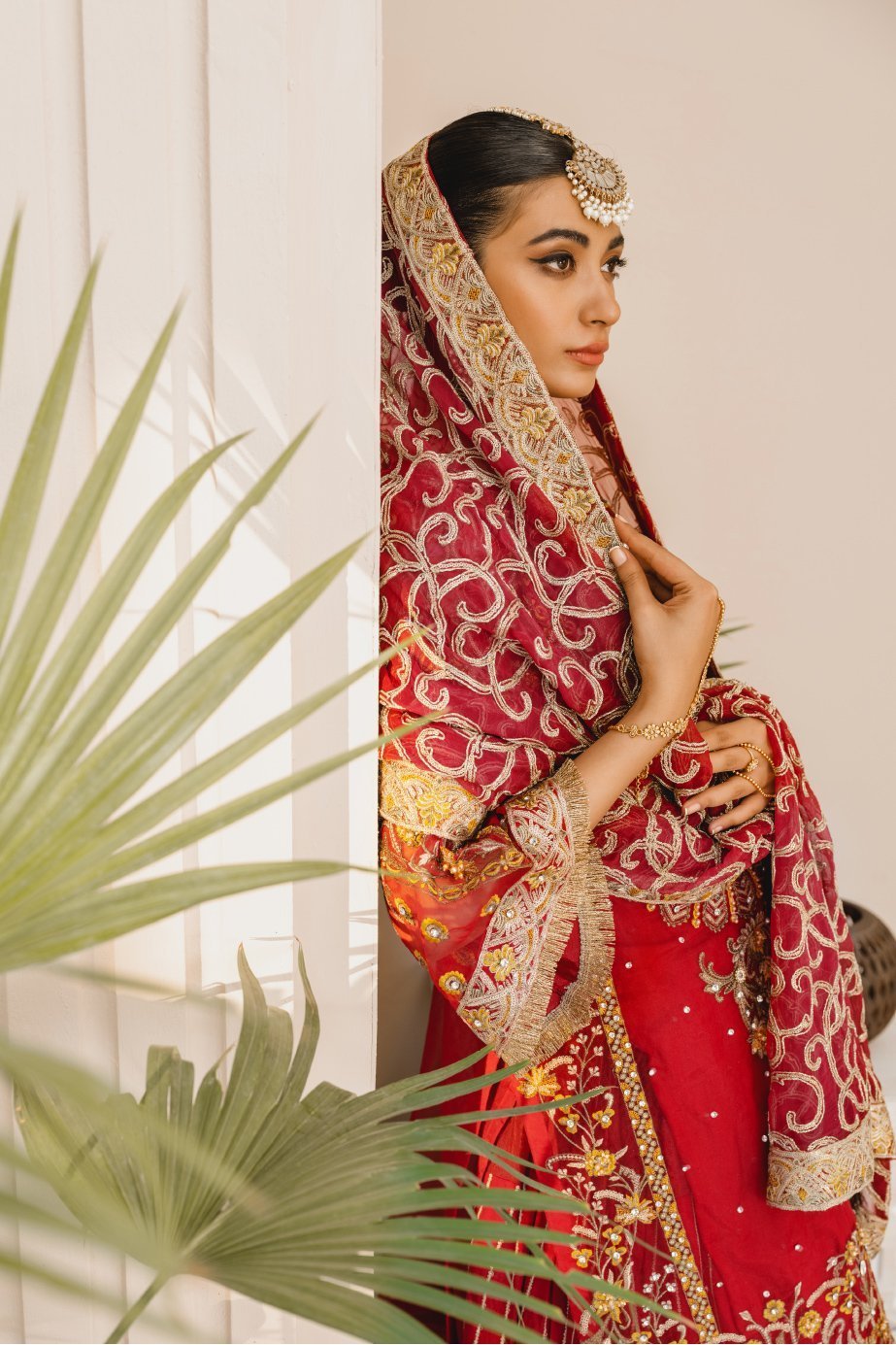 Formal Lehenga - Red & Red (MX-10) - Mashq Premium | A female model wearing a stunning and beautiful Formal Lehenga and posing for the Photoshoot of Mashq’s Formal Wear Collection