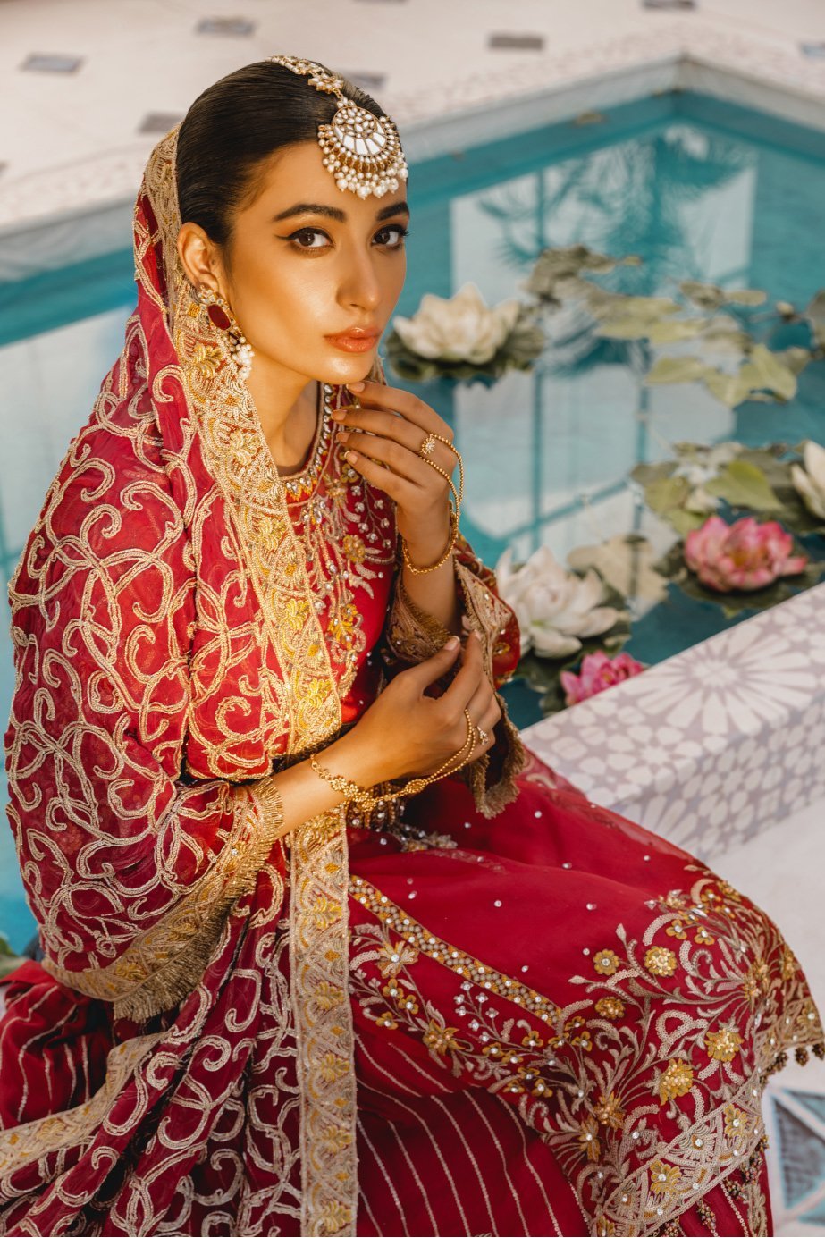 Formal Lehenga - Red & Red (MX-10) - Mashq Premium | A female model wearing a stunning and beautiful Formal Lehenga and posing for the Photoshoot of Mashq’s Formal Wear Collection