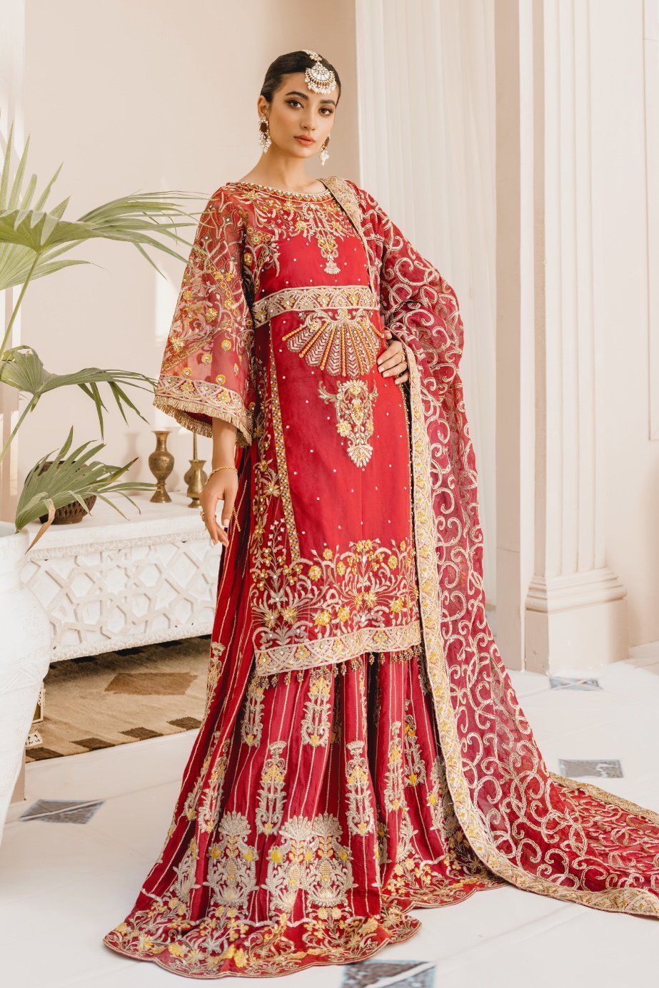 Formal Lehenga - Red & Red (MX-10) - Mashq Premium | A female model wearing a stunning and beautiful Formal Lehenga and posing for the Photoshoot of Mashq’s Formal Wear Collection